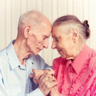 portrait of senior couple facing each other